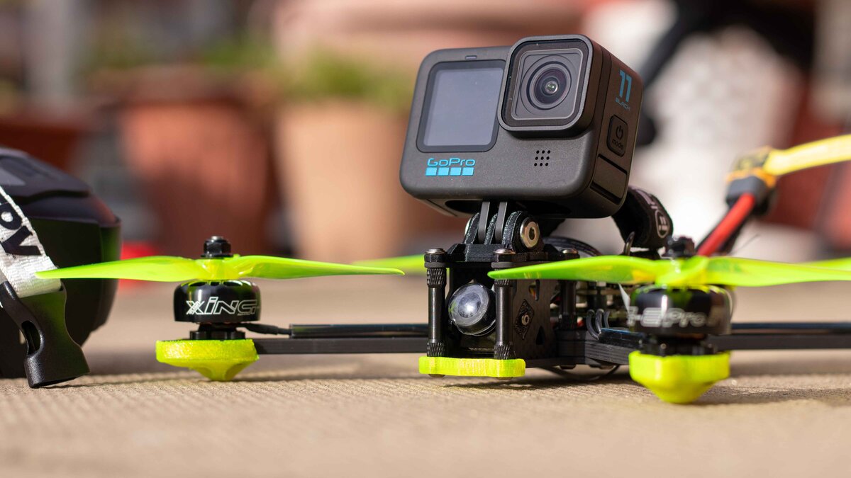 Green FPV aircraft fitted with a camera