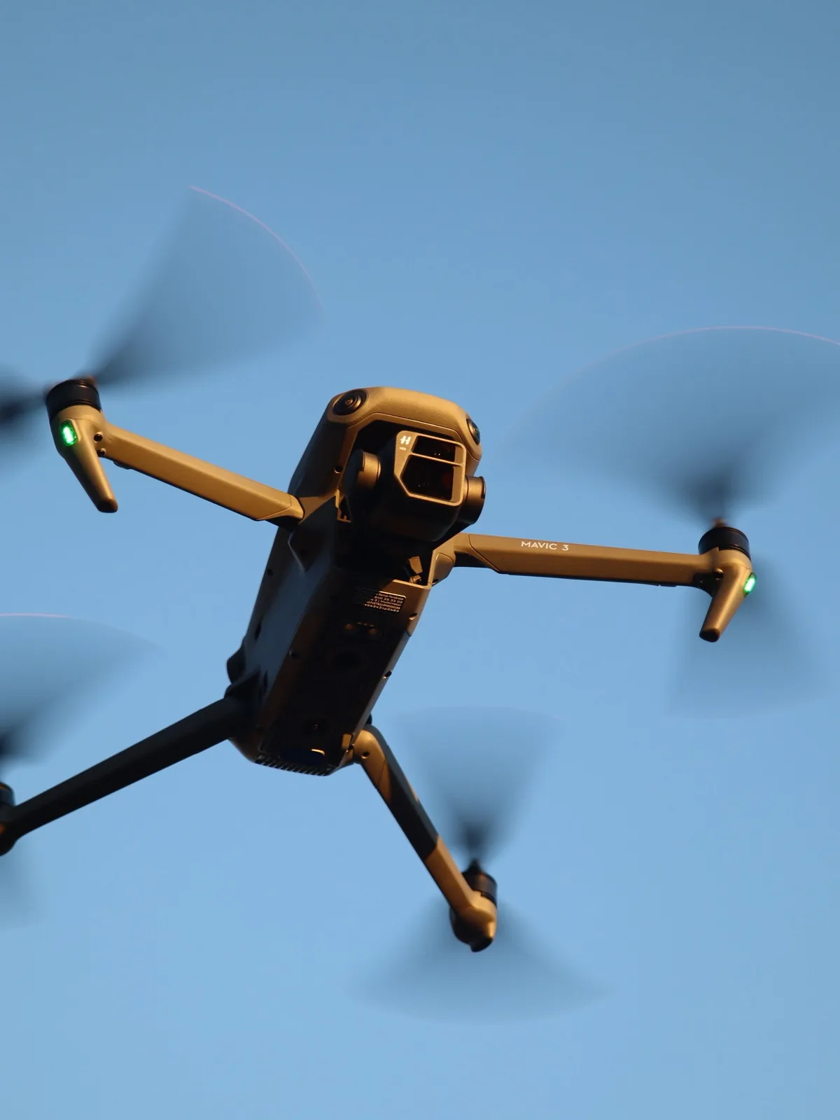 Drone viewed against a clear blue sky